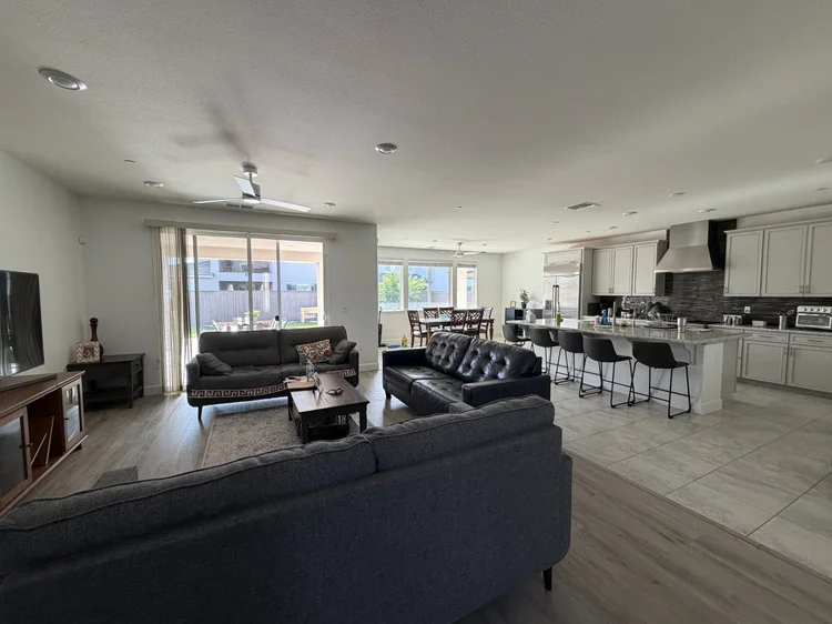 The open downstairs living area, looking through to the kitchen.